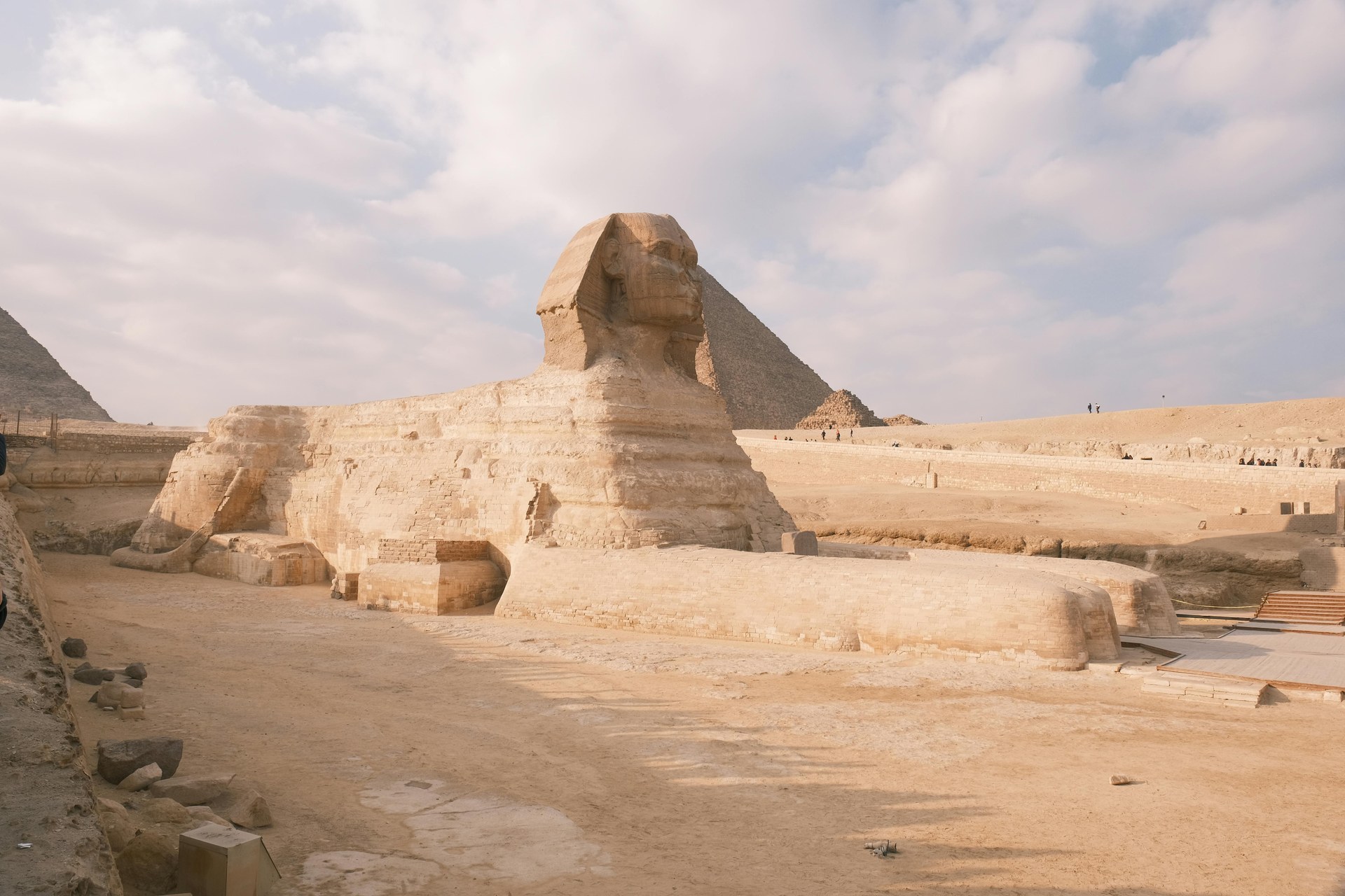 The Great Sphinx of Giza seen from the side with the pyramid of Khafre rising behind it